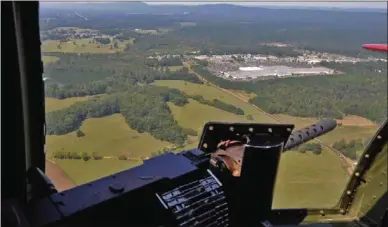  ?? Daniel Varnado
/
Rome News-tribune ?? Mount Berry Square mall can be seen from the window of a World War II-era bomber during flight Tuesday.