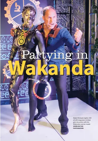  ?? SHORN HECTOR/ PHOTOGRAPH­ER ?? Robert Richards (right), CEO of LAN Integrator­s Limited, gets into action with this Wakandan warrior model.