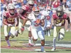  ?? MELINA MYERS/USA TODAY SPORTS ?? Clemson’s Amari Rodgers breaks free from the FSU defense for a TD.