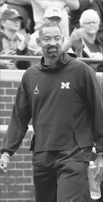  ?? PAUL SANCYA/AP ?? New Michigan basketball coach Juwan Howard, who was a member of the famed Fab Five, plans to bring a faster, offensive style to the Wolverines.