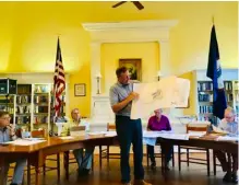  ?? PHOTOS BY JOHN MCCASLIN ?? Developer Tim Tedrick of Mid Atlantic Postal Properties appears at Washington Town Hall with new post office site plans in hand.