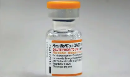  ?? Photograph: David Zalubowski/AP ?? A vial of Pfizer COVID-19 vaccine waits to be dispensed to pediatric patients at National Jewish Health in east Denver in November 2021.