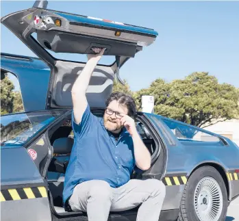  ?? BEN SKLAR/THE NEW YORK TIMES ?? Ernest Cline, an enthusiast of 1980s geek culture and author of“Ready Player Two,”with his DeLorean in Austin, Texas, in 2016.