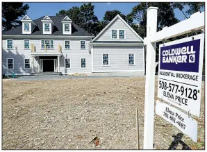  ?? AP/STEVEN SENNE ?? A new home sits for sale this month in Westwood, Mass. After a long slump this summer, long-term mortgage rates rose this week, according to mortgage buyer Freddie Mac.