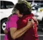  ?? AP ?? Members console each other after a shooting at Saint Stevens Episcopal Church in Vestavia, Ala.