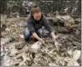  ?? BEN MARGOT — THE ASSOCIATED PRESS ?? Gina Baier looks for family heirloom china that may have survived in the remains of her home in the Coffey Park area of Santa Rosa on Tuesday.