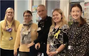  ?? ?? ●●Haslingden High School’ Modern Foreign Languages staff join in Hello Yellow Day, from left Holly Madden, Sian Nixon, Rob Kirk, Laura Connor and Megan Dearden