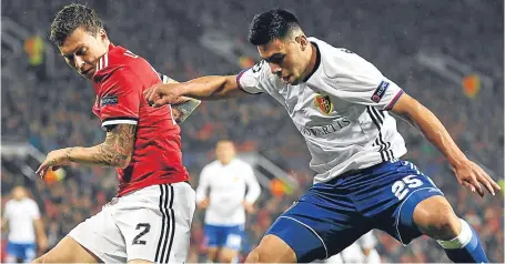  ?? Picture: Getty Images. ?? Victor Lindelof battles for possession with Blas Riveros of FC Basle.