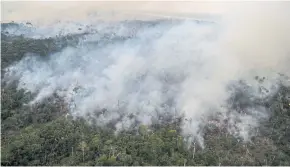 ?? AFP ?? Smoke rises from an illegally lit fire in the Amazon rainforest in Brazil.
