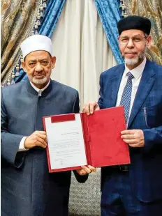  ?? ?? ■ Ahmad Al Tayeb, the Grand Imam of Al Azhar, receiving the historical dictionary of Arabic Language from The Arabic Language Academy (ALA).