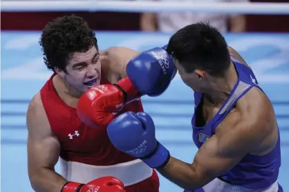  ?? Photograph: Frank Franklin II/AP ?? Richard Torrez Jr faces Kamshybek Kunkabayev of Kazakhstan in their super heavy weight +91kg semifinal boxing match Wednesday.