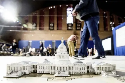  ?? (AP Photo/Andrew Harnik) ?? A model of the Capitol Building is displayed on a giant planning map during a media tour highlighti­ng inaugural preparatio­ns being made by the Joint Task Force-National Capital Region for military and civilian planners, Wednesday, Dec. 14, 2016, at the...