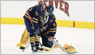  ?? David Zalubowski / Associated Press ?? Quinnipiac forward Ty Smilanic, left, consoles goaltender Keith Petruzzell­i after he gave up a goal to Minnesota State’s Ryan Sandelin in overtime of their NCAA West Regional semifinal game Saturday.