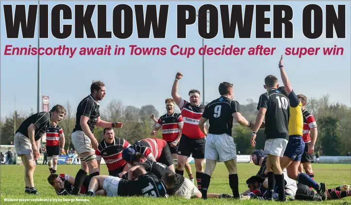  ??  ?? Wicklow players celebrate a try by George Naoupu.