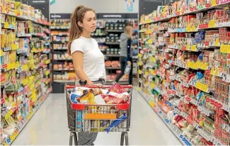  ??  ?? With panic buying, grocery spending was pushed up 17 per cent on the previous month.