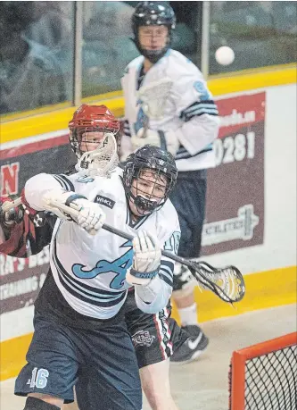  ?? BOB TYMCZYSZYN
THE ST. CATHARINES STANDARD ?? St. Catharines’ Gavin McGregor, foreground, is checked from behind in junior A lacrosse action versus Burlington Wednesday night at Jack Gatecliff Arena in St. Catharines.