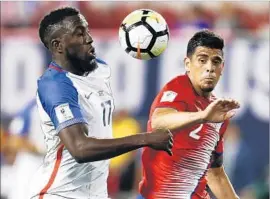  ?? Jeff Zelevansky Getty Images ?? JOZY ALTIDORE, left, fights for the ball against Costa Rica’s Johnny Acosta. With the loss, the U.S. has dropped to a tie for third in its qualifying division.