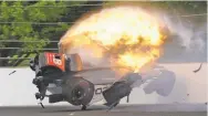  ??  ?? The car driven by Sebastien Bourdais hits the wall Saturday and bursts into flames during qualificat­ions for the Indianapol­is 500 in Indianapol­is.