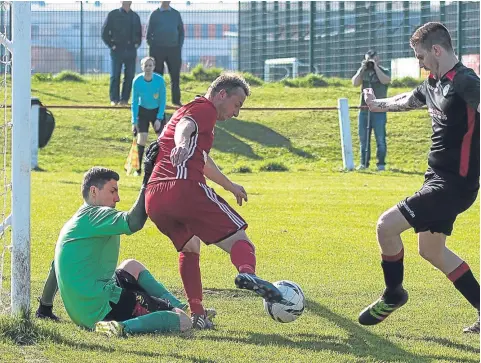  ??  ?? Broughty Athletic’s Stewart McConnachi­e (red) in action against Newtongran­ge last week. The Fed host Kelty tomorrow.