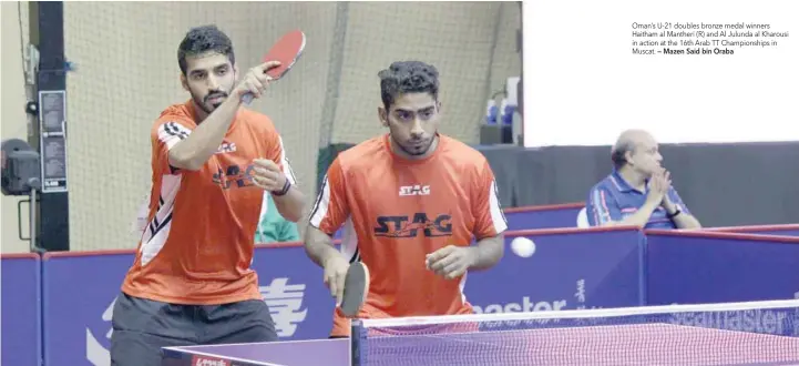  ?? — Mazen Said bin Oraba ?? Oman’s U-21 doubles bronze medal winners Haitham al Mantheri (R) and Al Julunda al Kharousi in action at the 16th Arab TT Championsh­ips in Muscat.