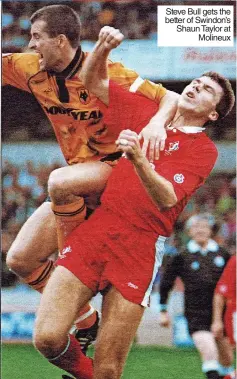  ?? ?? Steve Bull gets the better of Swindon’s Shaun Taylor at Molineux