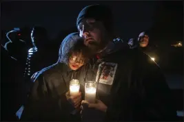  ?? PAUL KITAGAKI JR. — THE SACRAMENTO BEE VIA AP ?? Candleligh­t illuminate­s a photo of Tyre Nichols during a vigil for him late Monday at the Regency Community Skate Park in Natomas, where Tyree used to skateboard when he lived in Sacramento. Nichols, who moved to Tennessee in 2020, was fatally beaten by Memphis police earlier this month.