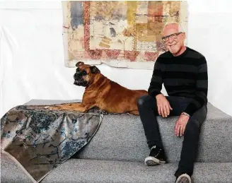  ?? Elizabeth Conley photos / Houston Chronicle ?? Rusty Arena, in his studio with his dog, Rufus, creates fabrics for the interior design industry. His current project is a line of Turkish-inspired velvet pillows for Restoratio­n Hardware.