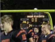  ?? DAVID TURBEN — THE NEWS-HERALD ?? North players gather after clinching the first playoff berth in school history, 28-7, over visiting Chardon on Oct. 27.