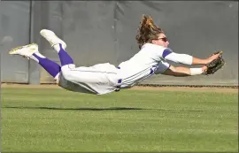  ?? Dan Watson/ The Signal (See additional photos on signalscv.com) ?? Valencia center fielder Scott Ogrin (2) dives to make a catch for the last out of the sixth inning against Saugus at Valencia High on Friday.