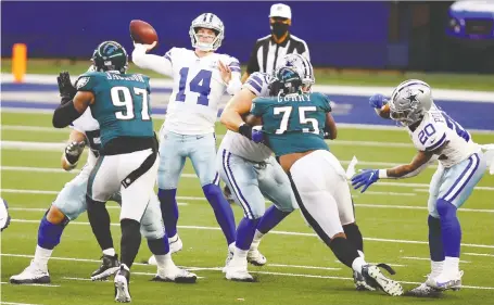  ?? TIM HEITMAN/ USA TODAY SPORTS ?? Dallas Cowboys quarterbac­k Andy Dalton throws a pass in the first quarter against the Philadelph­ia Eagles at AT&T Stadium in Arlington, Texas. Dalton had 377 yards passing as the Cowboys rallied from a first-half deficit to romp past the Eagles 37-17.