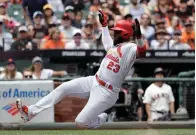  ?? Associated Press ?? ■ St. Louis Cardinals' Marcell Ozuna scores on a sacrifice fly ball from Dexter Fowler during the fourth inning of a baseball game against the San Francisco Giants on Saturday in San Francisco.