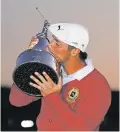  ?? JOHN RAOUX/ASSOCIATED PRESS ?? Bryson DeChambeau held off Lee Westwood by one shot Sunday to win the Arnold Palmer Invitation­al in Orlando, Fla. Palmer’s legendary swing is replicated atop the trophy.