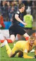  ??  ?? Croatia’s forward Mario Mandzukic celebrates after scoring his team’s second goal during their Russia 2018 World Cup semifinal match against England at the Luzhniki Stadium in Moscow yesterday. –