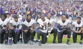  ?? MATT DUNHAM/AP ?? Ravens players kneel during the playing of the national anthem before their game against the Jaguars at Wembley Stadium in London on Sept. 24, 2017.