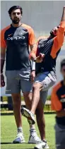  ?? AFP ?? Jasprit Bumrah and Ishant Sharma (left) attend a training session. —