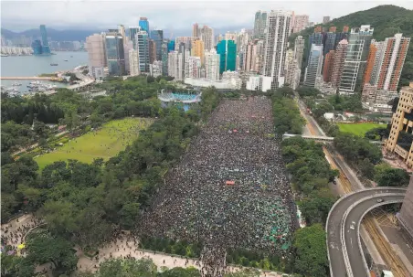  ?? Apple Daily ?? Prodemocra­cy demonstrat­ors gather in Hong Kong’s Victoria Park. Organizers estimated at least 1.7 million people turned out.