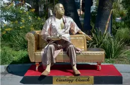  ?? — AFP ?? A gold sculpture by artists Plastic Jesus and Joshua Monroe of Harvey Weinstein on his infamous casting couch is on display in Hollywood, California, on Wednesday.