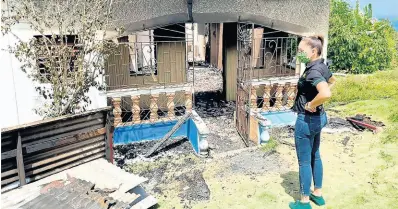  ??  ?? LEFT: Portland Eastern Member of Parliament Ann-Marie Vaz was teary-eyed as she surveyed the wreckage of the late Isolyn Christie’s home on Monday.