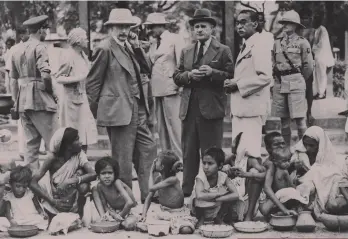  ??  ?? Calcutta, 1943: British viceroy Lord Wavell (left) and J.K. Biswas, chairman of the Rotary Club Relief Committee, during a visit to a free kitchen for victims of the Indian famine