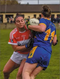  ??  ?? Louth’s Emma Singleton challenges Jackie Kinch of Wicklow.
