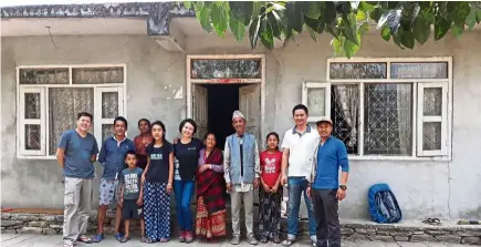  ?? — Hew Chei Wei ?? Hew (centre) with (from left) Deric Wong, Raj’s brother and family, Raj’s parents, Keu (second right) and Raj (far right), in front of Raj’s parents’ home in Batase, Nepal.