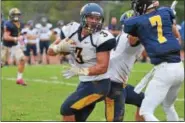  ?? SAM STEWART - DIGITAL FIRST MEDIA ?? Upper Perkiomen’s Austin Tutolo (3) bounces off a wouldbe tackler before spinning around PJP’s Matt DeLaurenti­s en route to a first down.