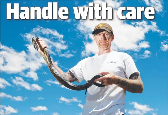  ??  ?? Justin Kneebone with a tiger snake. He says there has been strong interest in a venomous snake handling course.
Picture: Nikki Davis- Jones