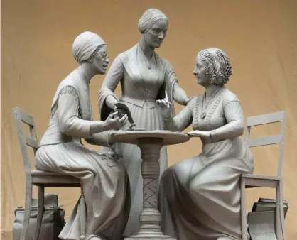  ??  ?? Sculpture of Sojourner Truth, left, Susan B Anthony, center, and Elizabeth Cady Stanton by Meredith Bergmann. Photograph: Michael Bergmann/AP