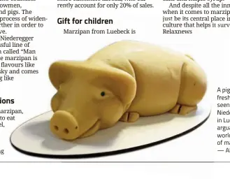  ?? — AFP ?? A pig made of fresh marzipan seen at JG Niederegge­r in Luebeck, arguably the world capital of marzipan.
