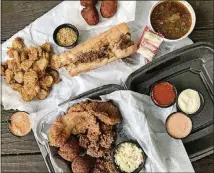  ?? CONTRIBUTE­D BY WENDELL BROCK ?? A feast from the Po’Boy Shop in Decatur (clockwise from left): fried pickles, boudin balls, gumbo, a combo platter with fried oysters, grouper, hush puppies and slaw, and a po’boy with fried shrimp, roast beef and its debris.