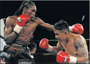  ?? Picture: GALLO IMAGES ?? ON A NEW HIGH: Thulani Mbenge, left, is to take on Argentinea­n Diego Chavez for the IBO welterweig­ht crown