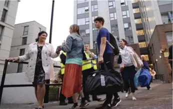  ?? STEFAN ROUSSEAU VIA THE ASSOCIATED PRESS ?? Five London highrise buildings were evacuated Friday to address fire-safety issues in light of the Grenfell fire.