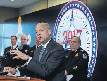  ?? [MANUEL BALCE CENETA/THE ASSOCIATED PRESS] ?? Homeland Security Secretary Jeh Johnson, with U.S. Capitol Police Chief Matthew Verderosa, back right, speaks during a news conference about the security for the presidenti­al inaugurati­on and activities related to it, Friday at the Multi Agency...