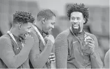  ?? Wally Skalij / Los Angeles Times ?? The two Houston-area players on the U.S. team — Jimmy Butler, left, and DeAndre Jordan, right — flank University of Texas product Kevin Durant after receiving their gold medals Sunday.